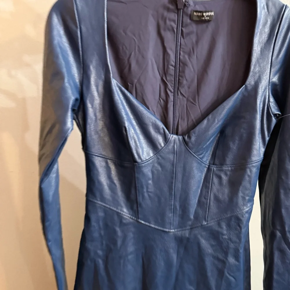 Naked wardrobe Dresses
Down to the Corset Long Sleeve Faux Leather Dress - Picture 3 of 4